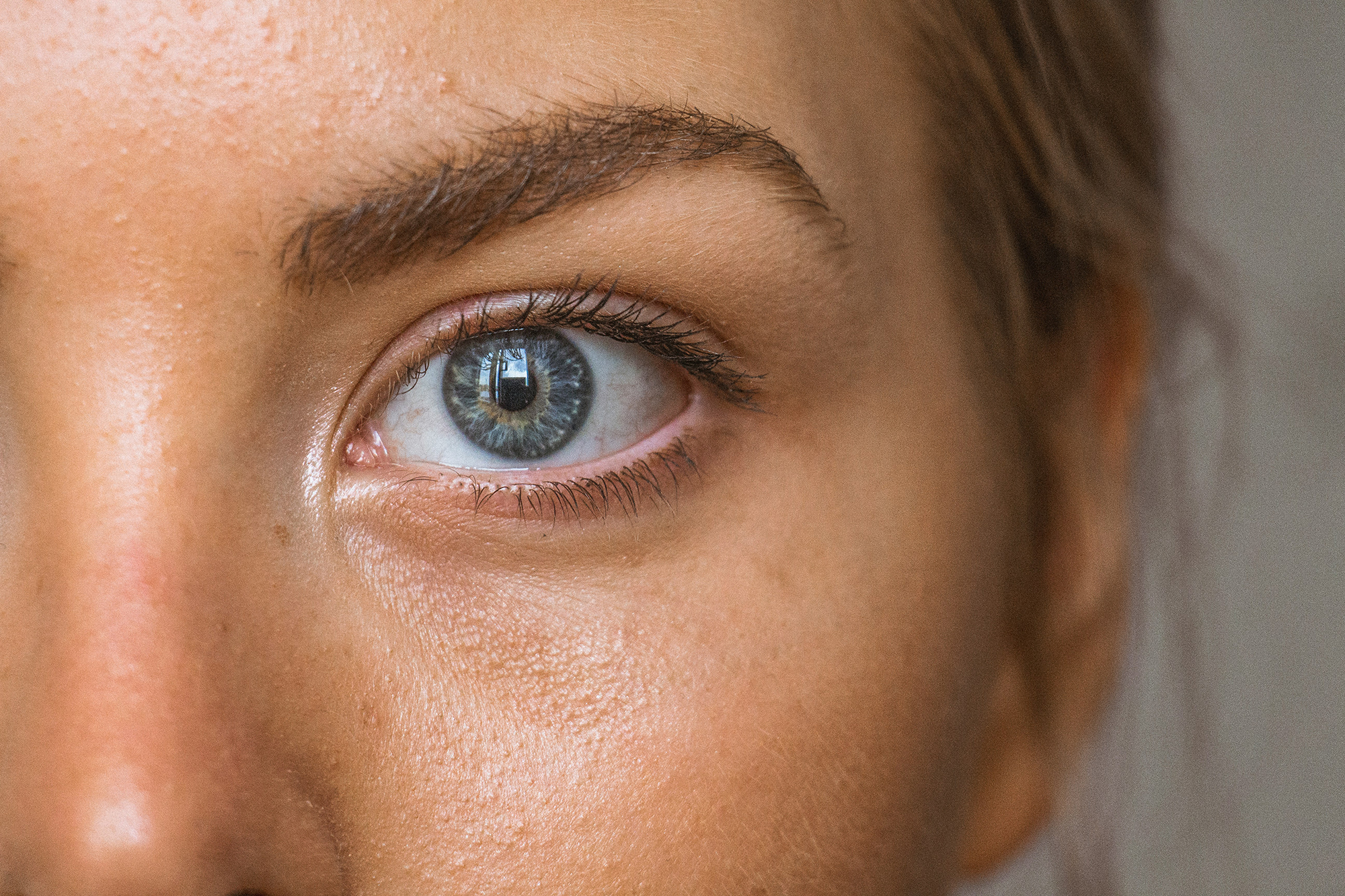 A female eye and cheek Image of a female eye and cheek